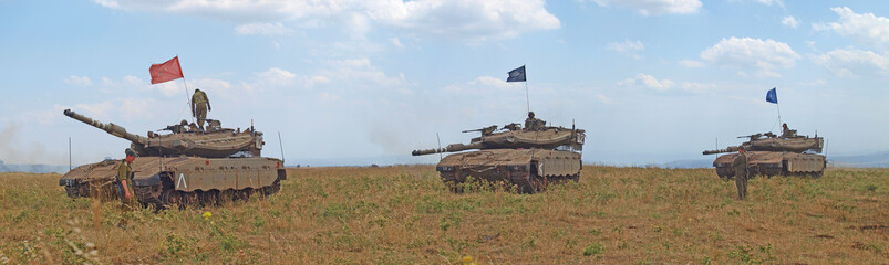 Merkava tanks and Israeli soldiers in training armored forces