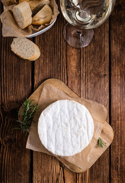 Creamy Camembert on wooden background