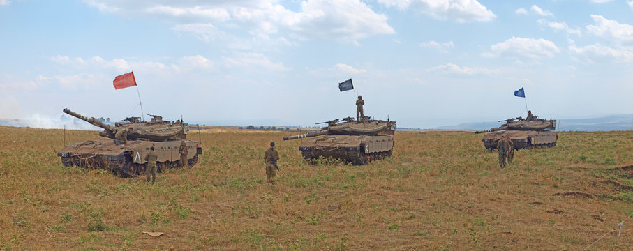 Merkava tanks and Israeli soldiers in training armored forces