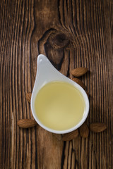 Bowl with almond oil (selective focus)