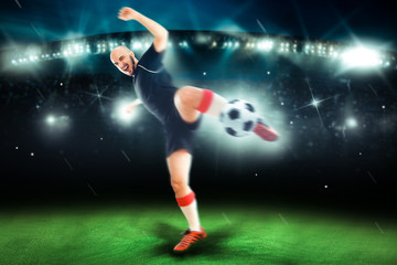 Fototapeta na wymiar Professional soccer player in the game shoot the ball