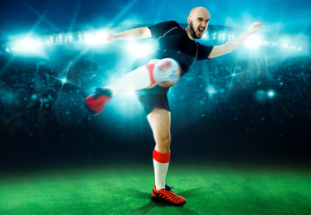 Fototapeta na wymiar Horizontal portrait of soccer player shoots the ball in the game