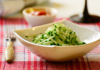 Cucumber salad in deep salad bowl.