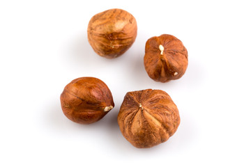 Hazelnuts on the white background