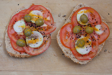 Healthy sandwich made with soy rolls with tomato, onions, green olives and spices.
