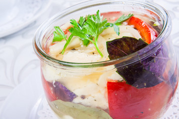 Pickled vegetables in a glass jar