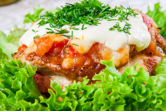 Armenian kyufta baked with cheese and tomato sauce