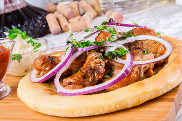 Grilled meat on pita bread