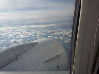 Fototapeta na wymiar View out from a window of a Plane