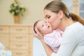 Loving nursing mother holding infant 