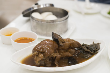 Traditional Chinese food Stewed pork leg and Chinese steamed bun