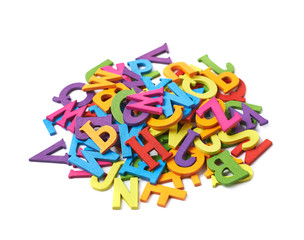 Pile of colorful wooden letters isolated