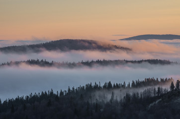 Carpathian mountains in the clouds, sunrise seen from Wysoka mountain in Pieniny, Poland