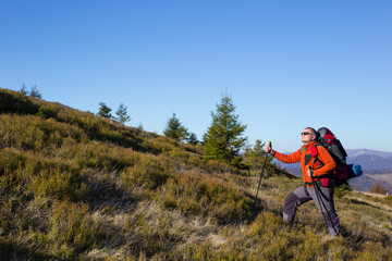 Hiking - hikers looking at view in Zion National park. People living healthy active lifestyle dong hike in beautiful nature landscape to Observation Point near Angles Landing, Zion Canyon, Utah, USA.