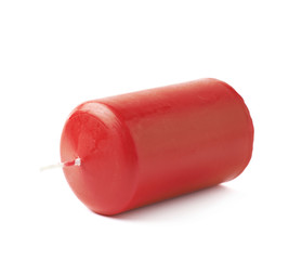 Unused red wax candle isolated