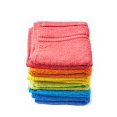 Pile of rainbow colored towels isolated