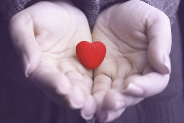 woman hands on heart