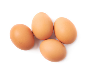 Four brown eggs composition isolated
