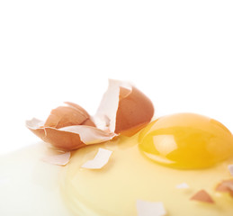 Cracked raw chicken egg isolated