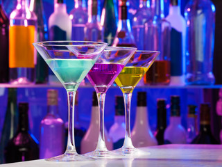 Three color cocktail glasses on the bar table