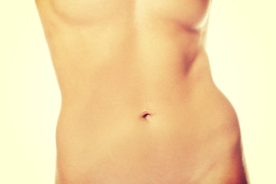 Slim naked woman's belly