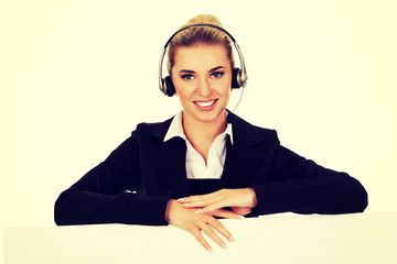 Smille call center woman holding empty banner.