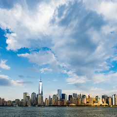 Fototapeta na wymiar New York City cityscape during day - with blue sky and white clouds