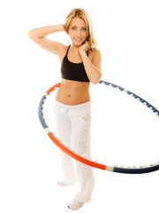 sporty fit girl doing exercise with hula hoop.