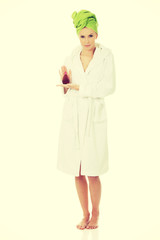 Beautiful woman with bottle of perfume.