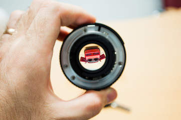 Anticipation of the new car seen through a camera lens - image inside is inverted