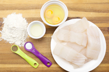 Pollock raw sliced fish and other ingredients for frying