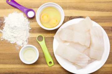 Pollock raw sliced fish and other ingredients for frying
