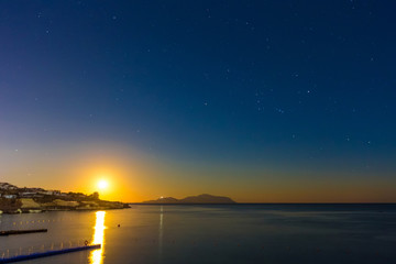 Fototapeta na wymiar Landscape with beautiful sunset and dark sky over Red sea