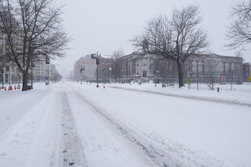Snow-covered empty road