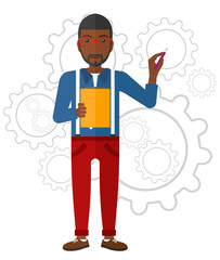 Man standing on gears background.