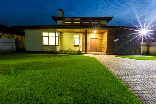 Detached Luxury House At Night View From Outside Front Entrance. 