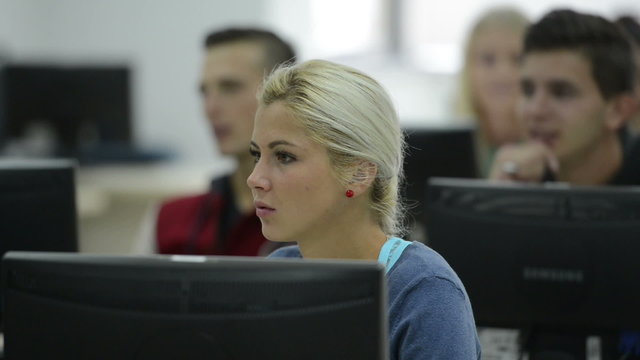 technology students group in computer lab classroom
