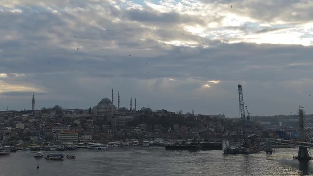 timelapse of Istanbul Turkey, cityscape on sunset with traffic  boats, ancient arhitecture and mosque on background