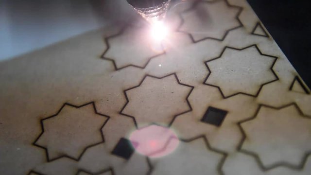 cnc laser  cutting of orient pattern decorative wood, modern industrial technology