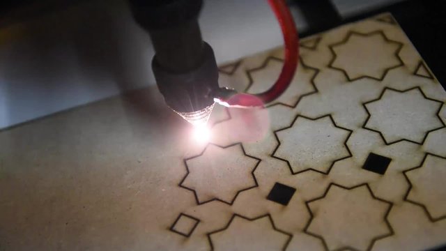 cnc laser  cutting of orient pattern decorative wood, modern industrial technology