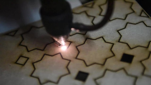 cnc laser  cutting of orient pattern decorative wood, modern industrial technology