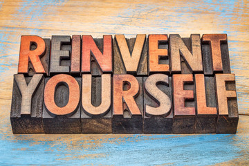 reinvent yourself - motivational words in vintage letterpress wo