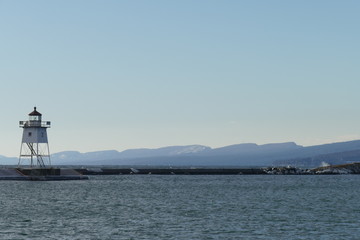 Fototapeta na wymiar Grand Marais Harbor looking toward Sawtooth Mountain Range, Lake Superior.