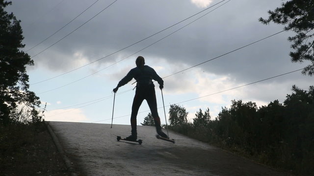 man on roller skates makes a morning jog