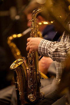 Hands musician playing the saxophone in a jazz band
