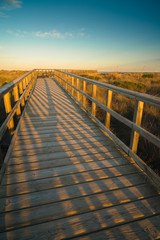 Footbridge to the sea at sunset near the San Pedro del Pinatar. Region of Murcia. Spain