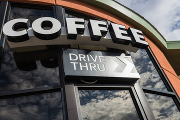 Coffee drive thru sign with reflect from glass window