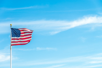 Obraz premium United States of America flag with blue sky