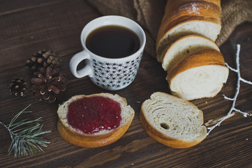 Mug of coffee and a sandwich from the loaf with jam 5087.