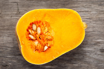 Fresh butternut squash slice on wooden table